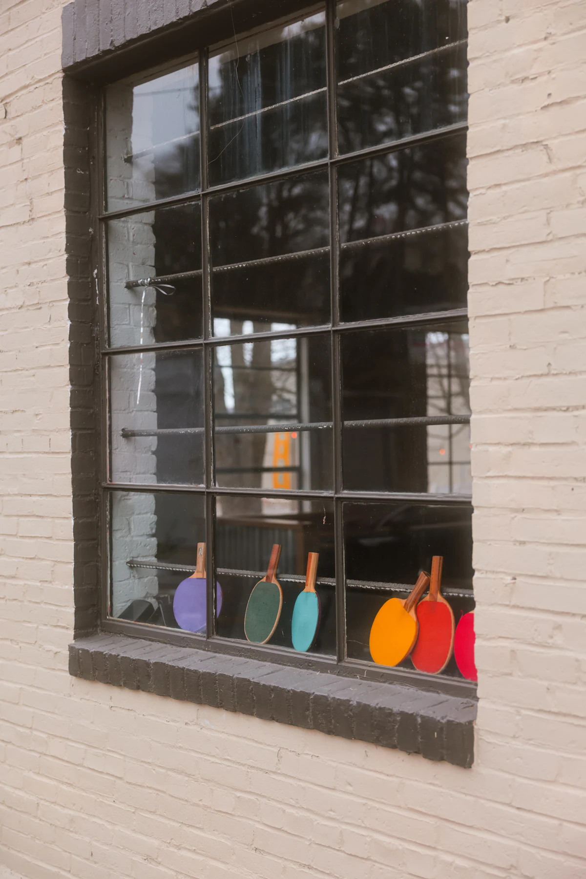 Table tennis paddles on a window sill