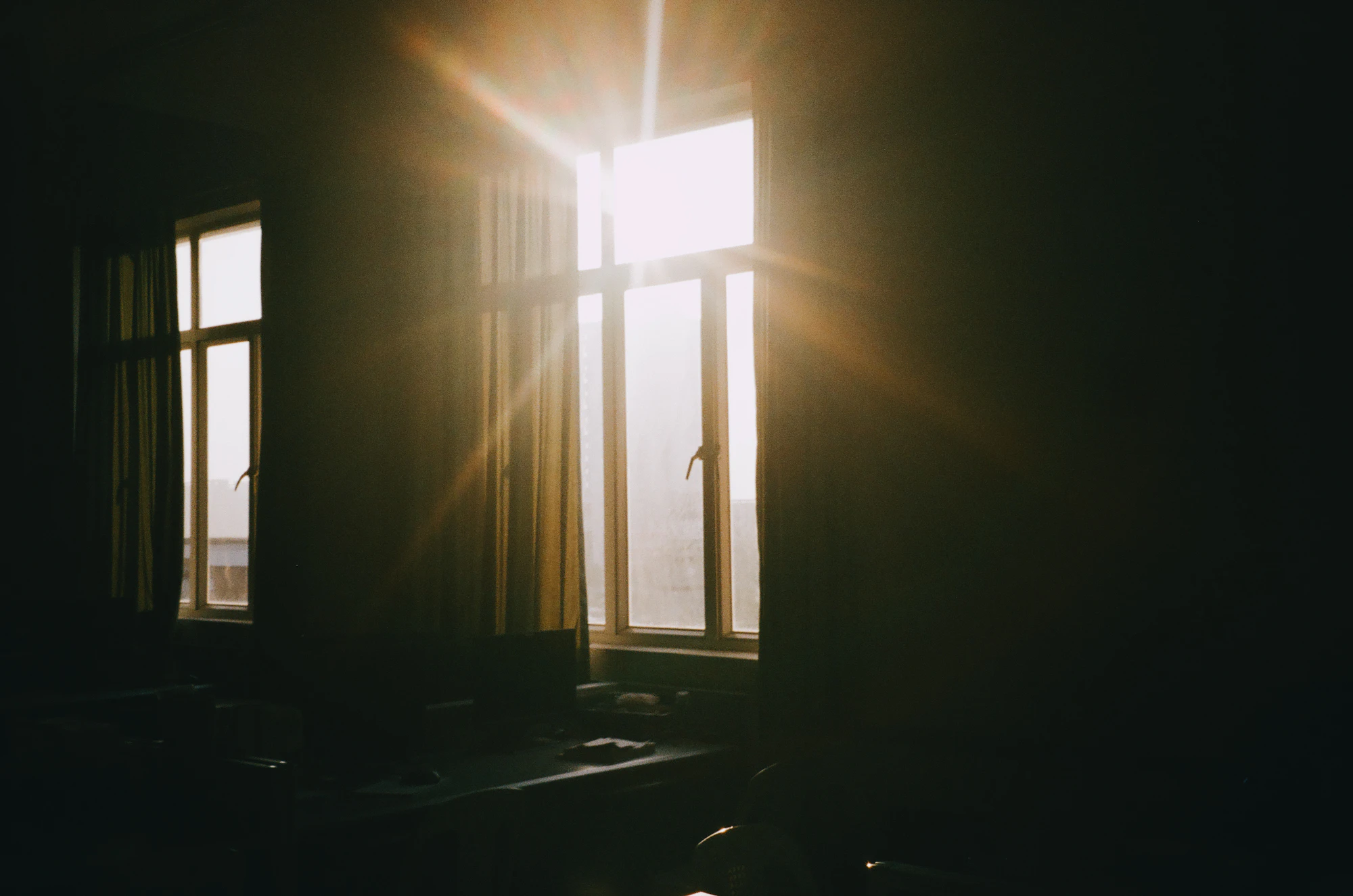 Sunlight through a window into a dark room